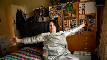 Donna Staehr at her Adelaide home in a radiation suit designed to treat her Morgellons symptoms.