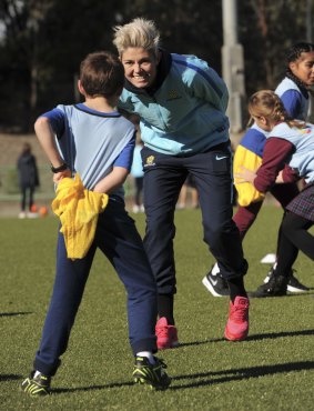 Michelle Heyman plays Oztag with the MiniRoos during a Matildas training camp last week.