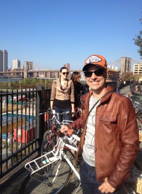 Barry Divola with bike on the Brooklyn Promenade.