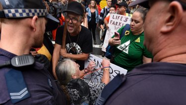 Colleen Fuller, 57 (seated in wheelchair), during a protest against the state government's crackdown on protests on Tuesday. 
