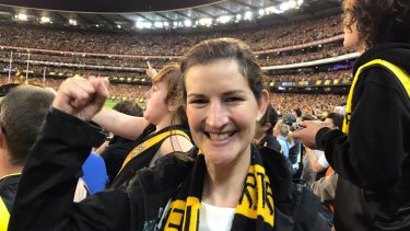 Greens MP Ellen Sandell cheers on Richmond after accepting free tickets to the game.