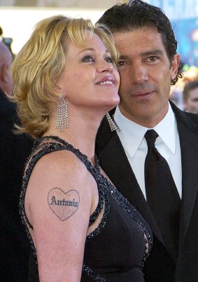Melanie Griffith complete with Antonio and tattoo.
