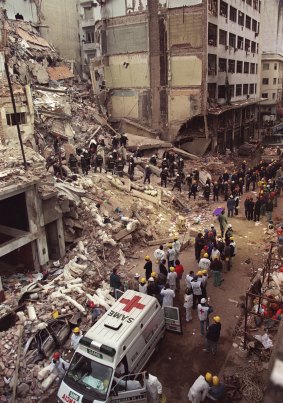 Firefighters and rescue workers search through the rubble of the Argentine-Israeli Mutual Association community centre after the bombing in 1994.