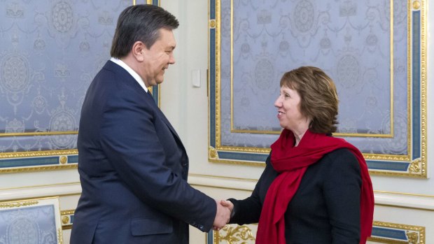 Ukraine's President Viktor Yanukovich shakes hands with EU foreign policy chief Catherine Ashton.