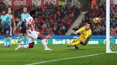 Stoke City's Wilfried Bony (centre) scores his side's opening goal in the match against Swansea City.