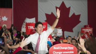 Liberal Leader Justin Trudeau waves to supporters as he takes the stage at a campaign rally in Winnipeg, Manitoba, Canada on Saturday.