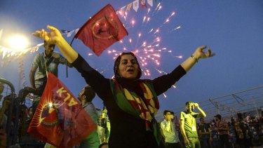 A supporter of the People's Democratic Party (HDP) celebrates in Diyarbakir.
