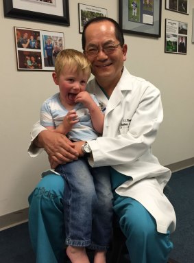 Ollie Lanham and Dr T.S. Park who performed his surgery at St Louis Children's Hospital in Missouri.