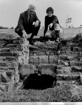 Judy Birmingham shows part of an excavated kiln to the Hunter Water president at an archaeological dig on June 6, 1969.
