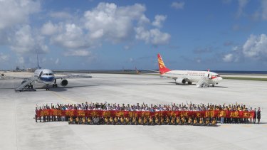 Two Chinese passenger jets land on Fiery Cross Reef in the Spratly Islands in the South China Sea in January in a test to see whether its airstrip was up to standard. .