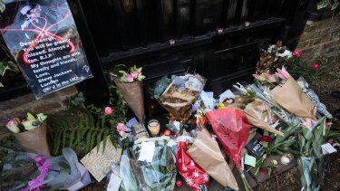 Fans left flowers and cards outside his home. 