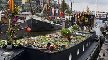 Flowers have been left on the houseboat where Jo Cox lived in Hermitage Moorings on the River Thames in Wapping, London.