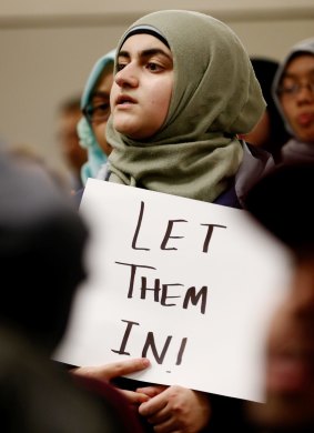 A protester demonstrates against US President Donald Trump's travel ban at Dallas-Fort Worth International Airport on Saturday.