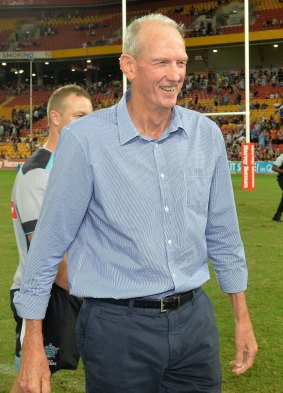 Relaxed: Wayne Bennett with his World players after the match between the Indigenous All-Stars and the World All-Stars at Suncorp Stadium on Saturday.