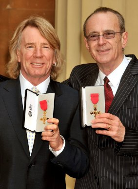  Rick Parfitt and Francis Rossi with their OBEs at Buckingham Palace in 2010. 