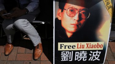A protester displays a portrait of jailed Chinese Nobel Peace laureate Liu Xiaobo during a demonstration in Hong Kong earlier this month.