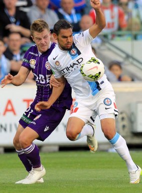 Melbourne City's David Williams controls the ball under pressure from Scott Jamieson of Perth Glory when the teams met on Boxing Day.
