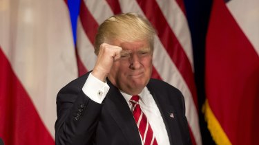 Republican presidential candidate Donald Trump pumping fist.