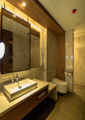 A bathroom and shower at the first class lounge.