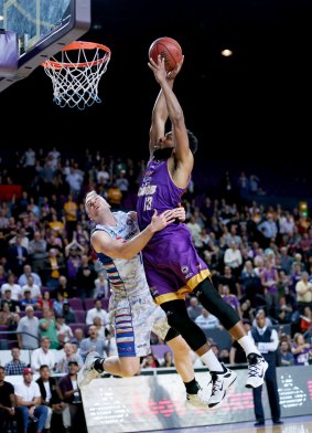 High flyer: Sydney's Dion Prewster goes up for a dunk against Adelaide.