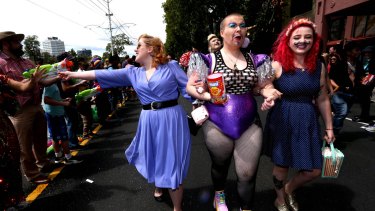 Revelers enjoy the day at the annual Misdsumma Pride March in St Kilda. 