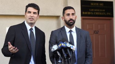 Attorneys David Chesley and Mohammad Abuershaid speak to reporters in Los Angeles on Friday. The two are attorneys for the family of the late Syed Farook, one of the heavily armed San Bernardino shooters.