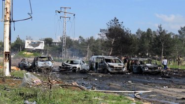 The charred and damaged cars at the scene of an explosion in the Rashideen area, outside Aleppo city, Syria, Saturday.