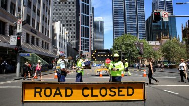 Construction workers organise the implementation of the light rail system in the CBD.