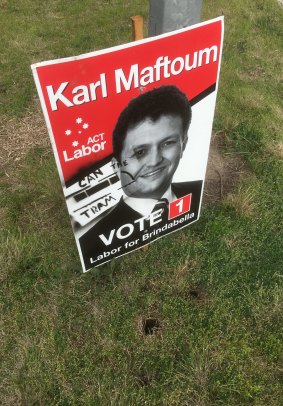 A sign for Labor candidate Karl Maftoum, which was defaced along Drakeford Drive on Thursday.