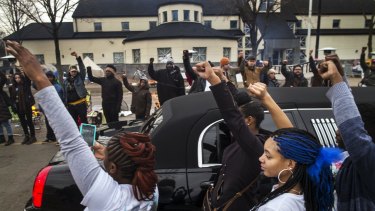 Family members of Jamar Clark got out of a limousine to show support for the Black Lives Matter supporters as Clark's funeral procession passed by the Minneapolis Police Department's 4th Precinct in Minneapolis on Wednesday last week.