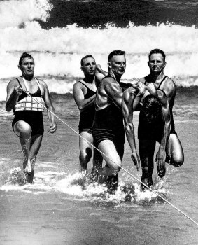 Bondi Surf Life Savers rescue a person during a surf carnival in the 1930s.