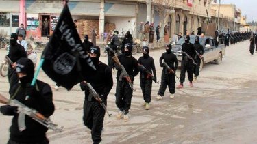 This undated photo posted on a militant website in January 2014 shows fighters  from Islamic State marching in Raqqa, Syria. 