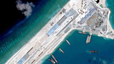 Reclamation: A satellite image taken in April shows a Chinese airstrip under construction on Fiery Cross Reef in the South China Sea.
