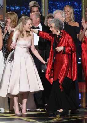 Elisabeth Moss, left, and author Margaret Atwood embrace as "The Handmaid's Tale" wins the award for outstanding drama series at the 69th Primetime Emmy Awards on Sunday, September 17, 2017, at the Microsoft Theater in Los Angeles.
