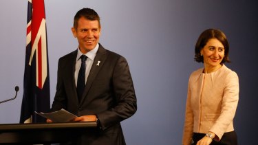 All smiles: NSW Premier Mike Baird and Treasurer Gladys Berejiklian last month. The budget half-yearly review detailing the budget windfall is expected to released on Thursday.