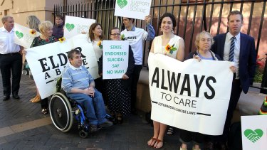 Campaigners gather outside Parliament on Thursday ahead of the debate on a bill to allow terminally ill patients over 25 to end their own lives in the Upper House.