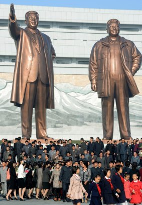 Statues of North Korean leaders Kim Il-sung (left) and Kim Jong-il on the 69th anniversary of the founding of the Workers' Party of Korea.
