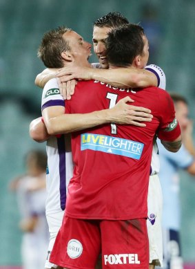 Jubilation: Perth Glory players celebrate their come-from-behind win.