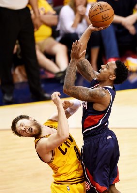 Contact: Hawks guard Jeff Teague collides with Cleveland counterpart Matthew Dellavedova.