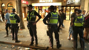Swanston Street was awash with police officers in the early hours of Sunday morning.