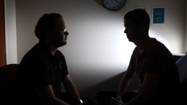 Mark (right) discusses his problems with a counsellor