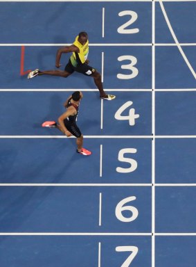 Bolt and de Grasse cross the line in first and second place.
