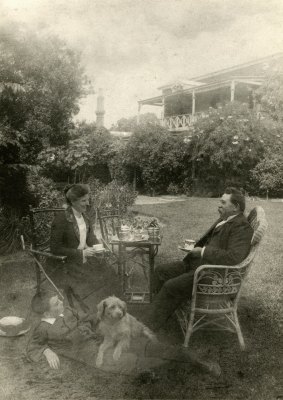 Taking tea in the garden: William Robert Guilfoyle with his wife Alice (c.1903), son and dog.