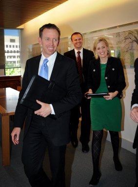 Shane Rattenbury after signing the power-sharing agreement in 2012, with Andrew Barr and Katy Gallagher in the background.