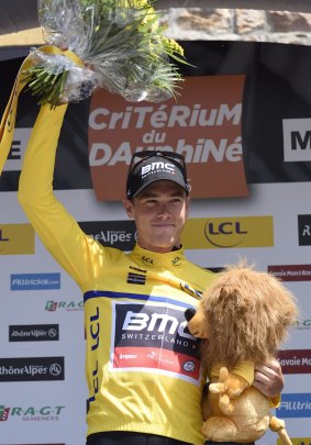BMC's Australian rider Rohan Dennis on the podium in his yellow leader's jersey on Tuesday.