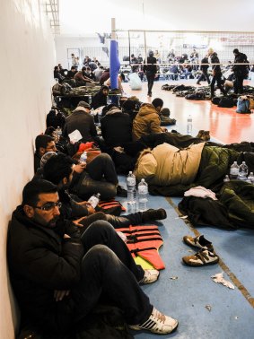 Asylum-seekers from the Blue Sky M cargo ship resting at a first aid centre set up at Gallipoli, on Italy's southern coast.