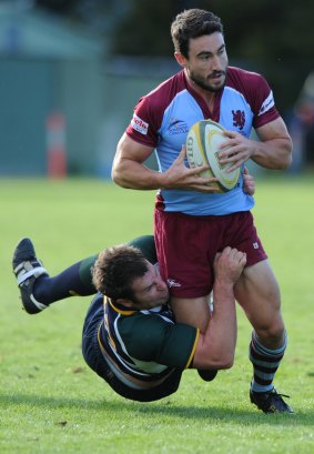 Sasha Mielczarek, who won the heart of The Bachelorette Sam Frost, goes in for a killer tackle playing for Uni-Norths rugby team in Canberra in 2012