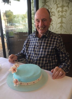 Ian Clark celebrates his 81st birthday with a cake baked by his 12-year-old grandson, Thomas.