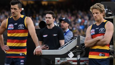 Came up short: Disappointed Crows skipper Taylor Walker and midfield star Rory Sloane. Walker was criticised for his performance in the grand final. 