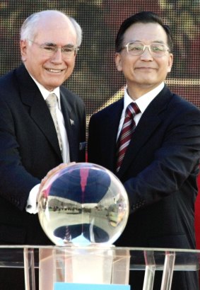 June 2006: John Howard and then Chinese premier Wen Jiabao press a launch button to mark the beginning of deliveries of liquid natural gas to China's Guangdong province.